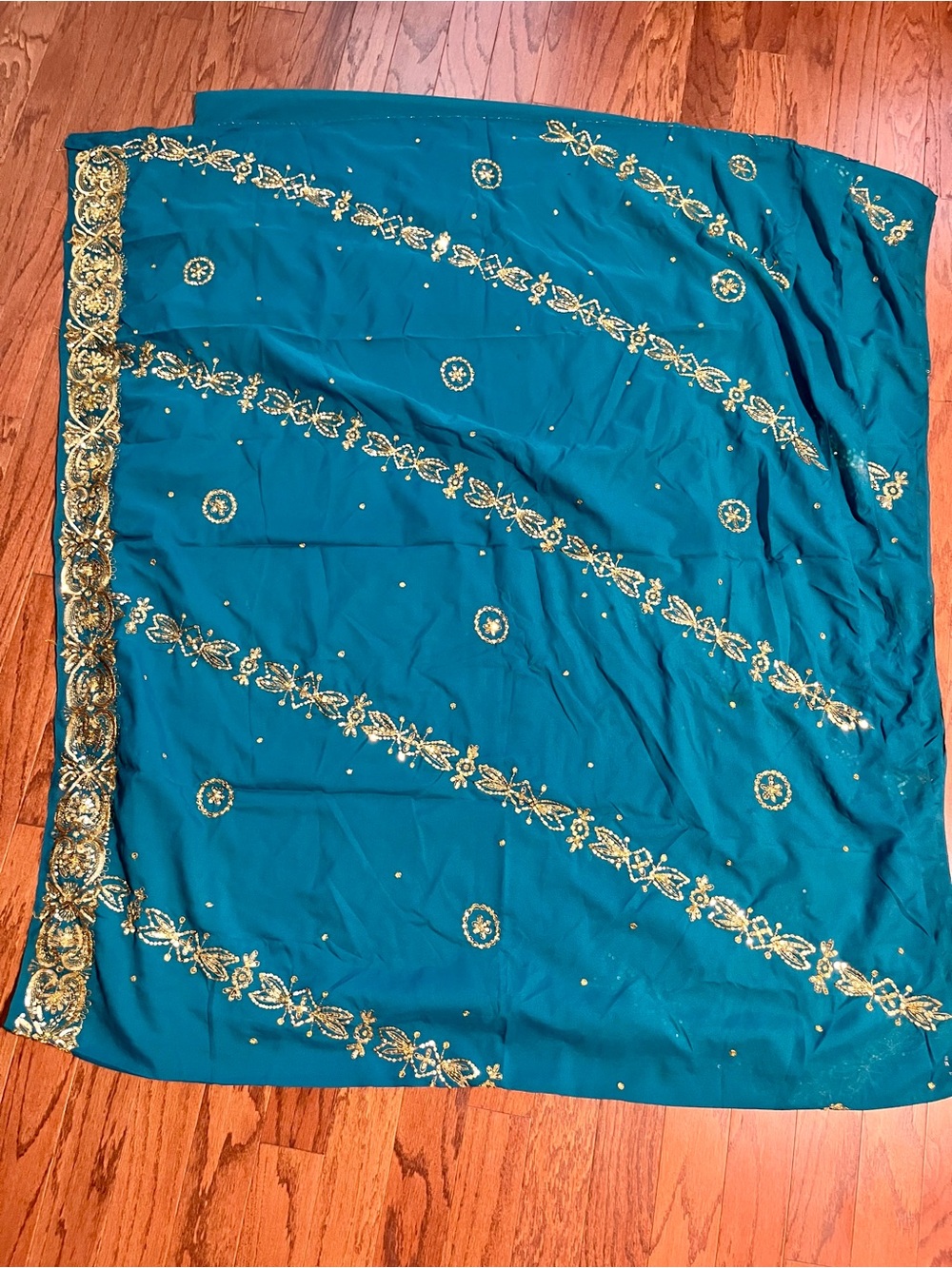 Embroidered Teal Saree with Gold Accents